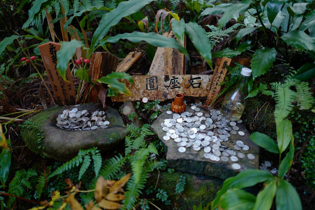 Coins at a shrine